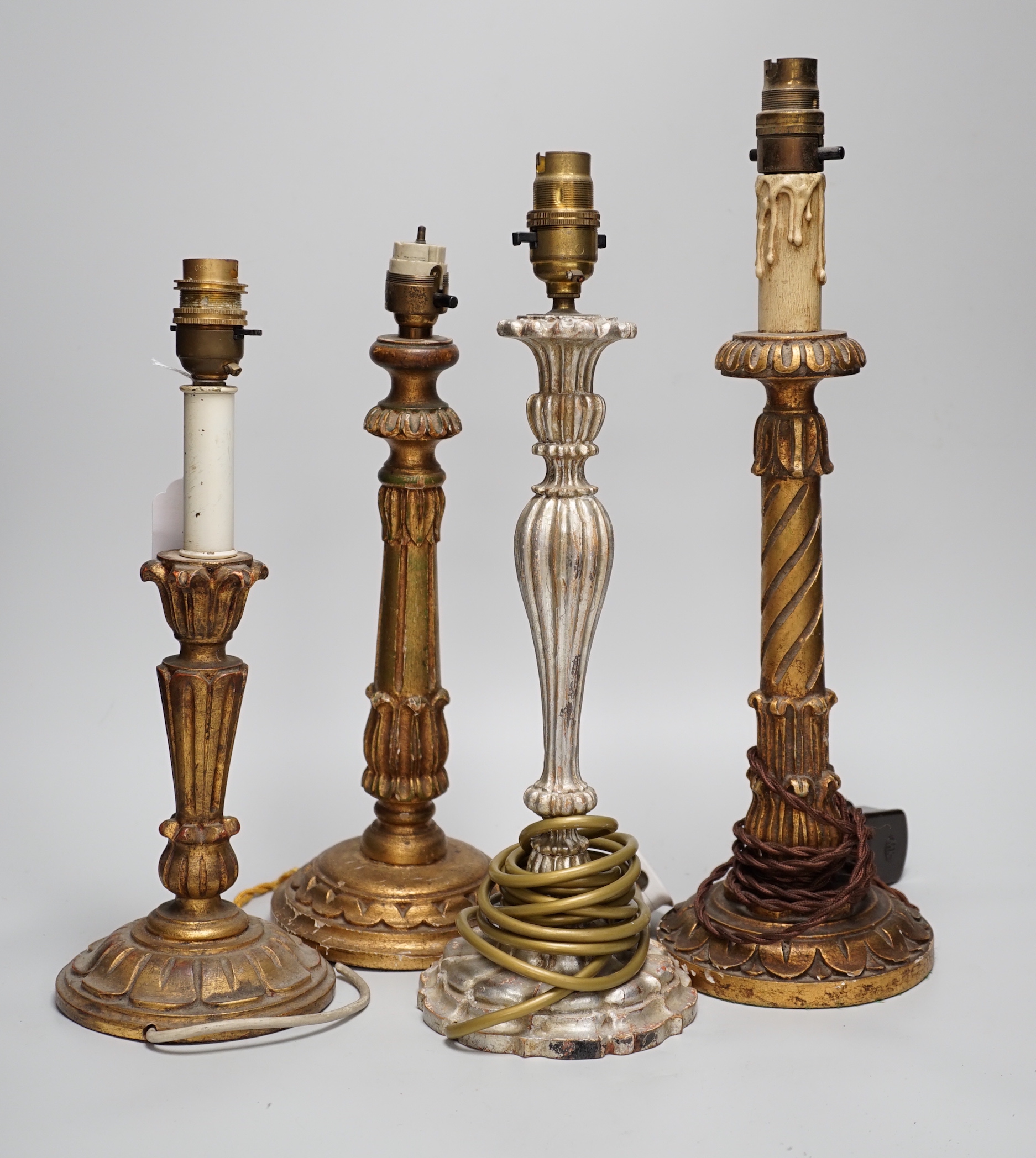 Four antique-style gilt and silvered wood table lamps, the largest 43cm high including the fitting